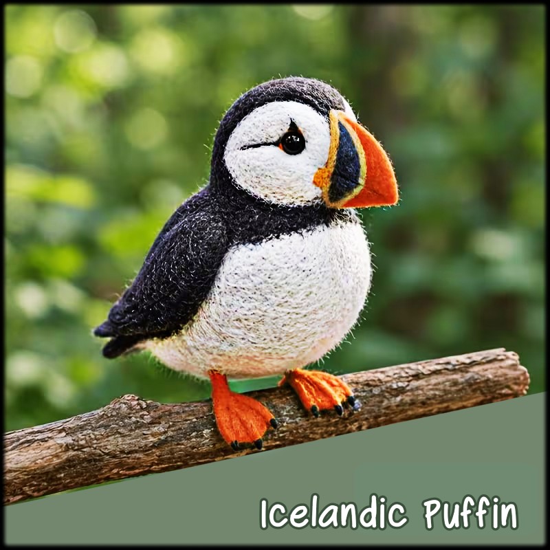 Needle-felted puffin figurine standing on a branch with a blurred green background