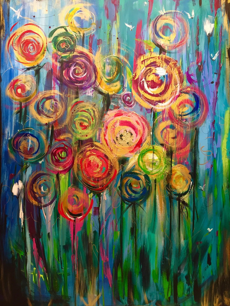Colorful abstract painting of swirling circular flowers in pink, red, yellow and green on a blue background