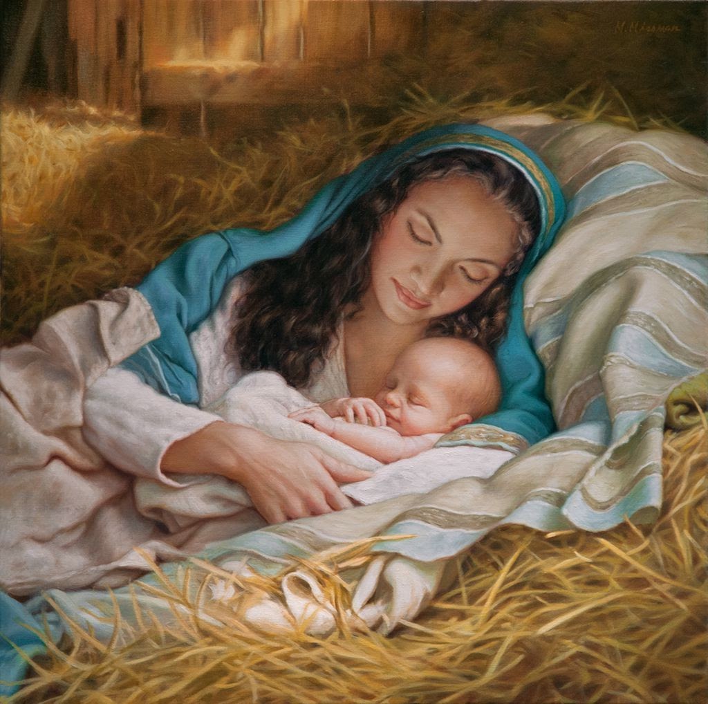 Woman in blue headscarf tenderly holding sleeping infant in hay-filled manger