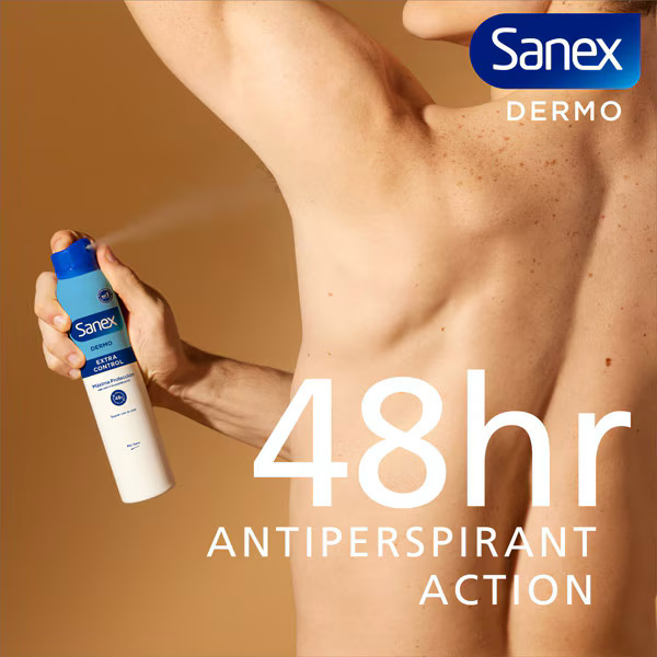 Shirtless male torso holding a Sanex Dermo antiperspirant spray can with text on a beige background