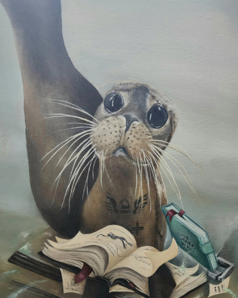 Close-up of a seal with long whiskers looking at an open book