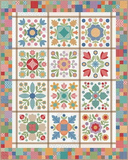 Colorful folk art quilt with floral blocks and patchwork border in traditional American style