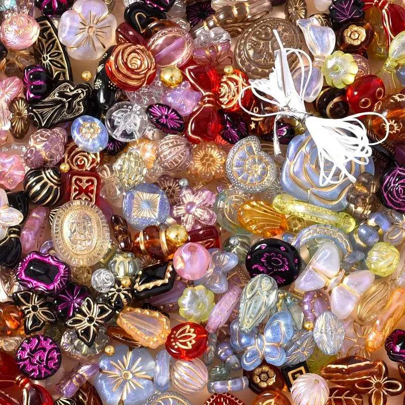 Close-up of assorted colorful glass beads and decorative ornaments piled together