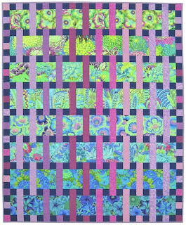 Colorful patchwork quilt with woven purple, pink, green and blue fabric strips in interlaced lattice pattern