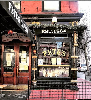 Pete's Tavern historic bar exterior with EST. 1864 sign and dark green storefront in New York City