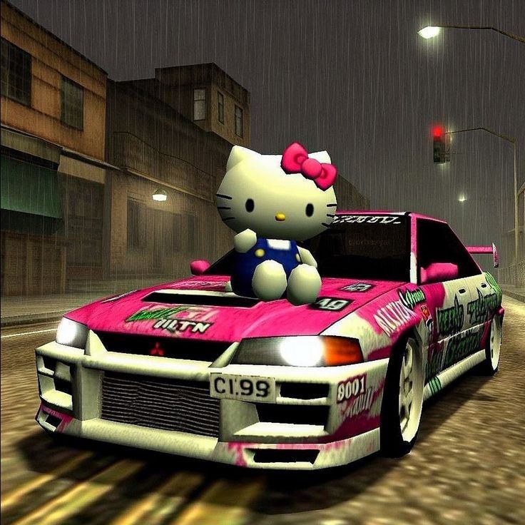 Hello Kitty sitting on a pink drift car on a rainy city street at night