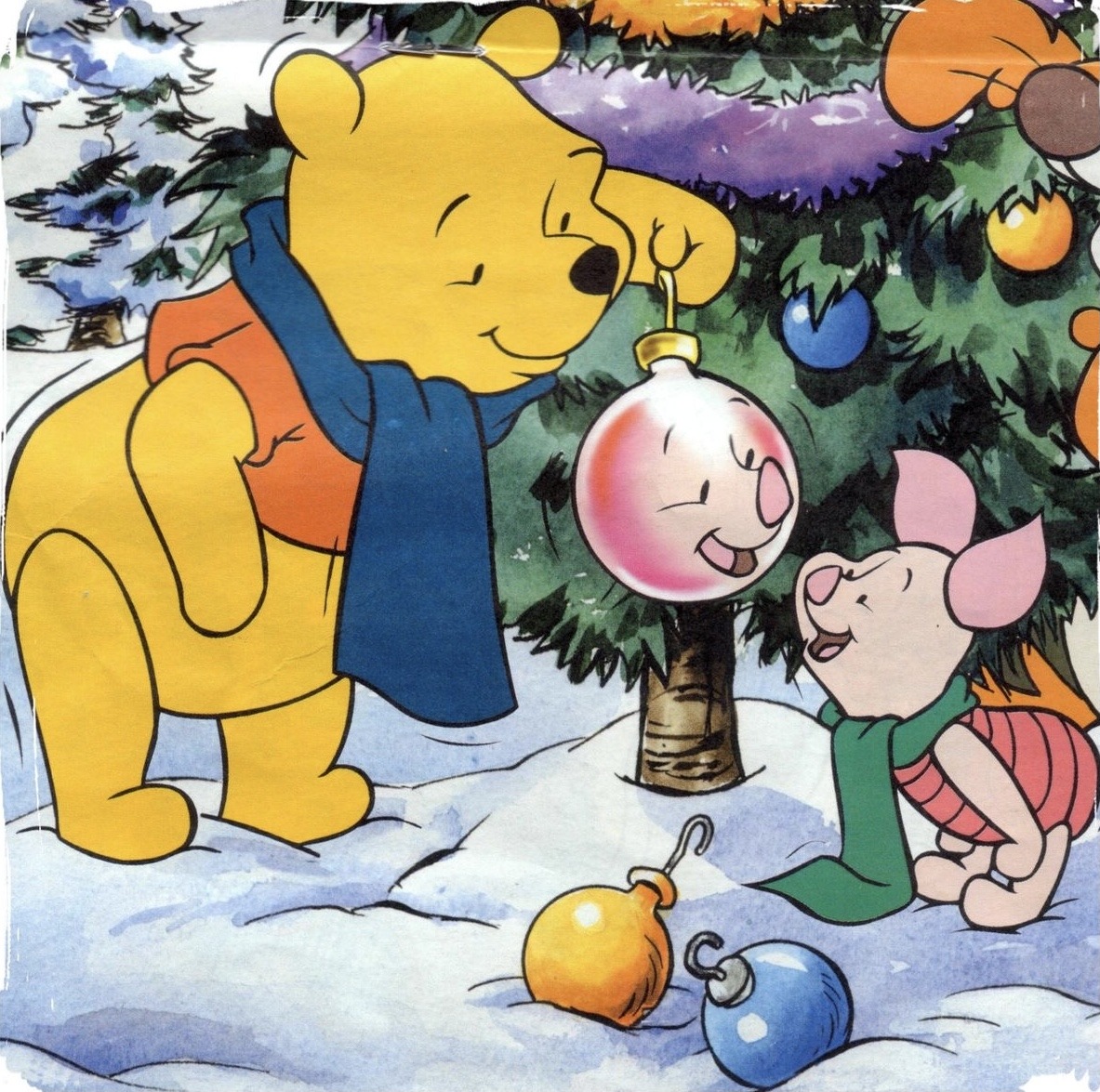 Winnie-the-Pooh and Piglet decorating a Christmas tree outdoors in winter snow with ornaments