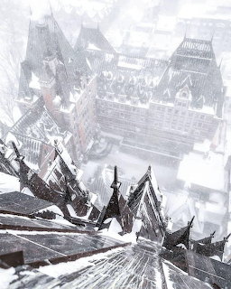 Snowy rooftops and Château Frontenac in a foggy winter city scene