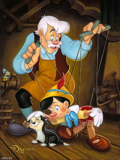 Geppetto controls Pinocchio with strings as Figaro the cat sits beside them in a workshop