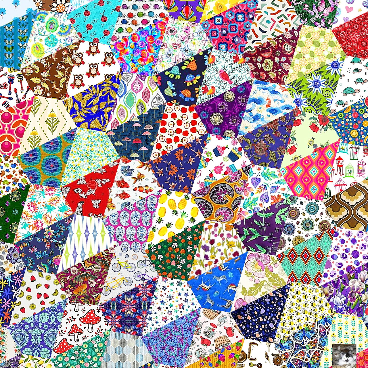 Colorful patchwork quilt with diverse patterns including flowers, dots, stripes, and geometric designs in various colors
