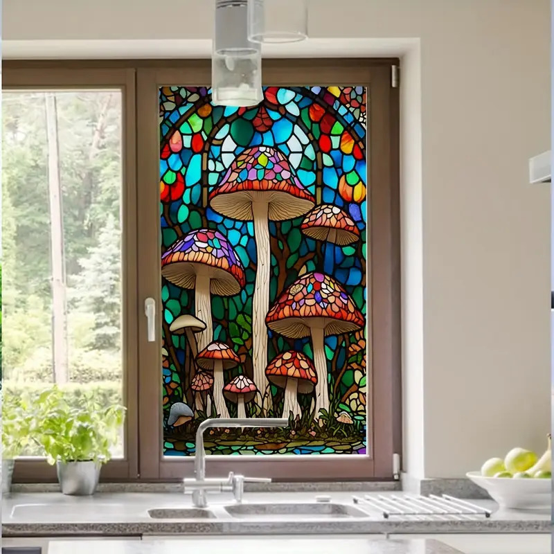 Colorful stained glass panel of mushrooms above a kitchen sink beside a sunlit window