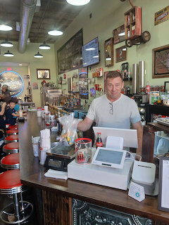 Malt Shop Owner Behind Counter