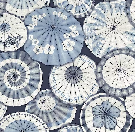 Blue and white parasols arranged in an overlapping pattern viewed from above