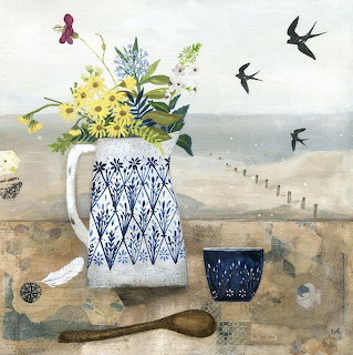 White ceramic vase with yellow flowers and blue patterns on weathered table, birds in flight over seaside scene