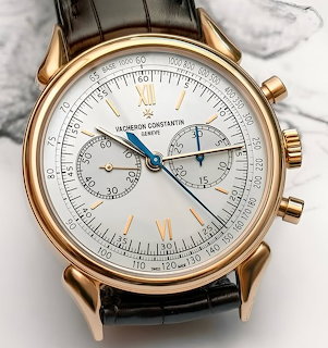 Vacheron Constantin gold chronograph watch with white dial and brown leather strap
