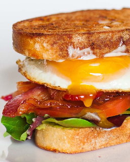 Toasted bacon and egg sandwich with lettuce and tomato