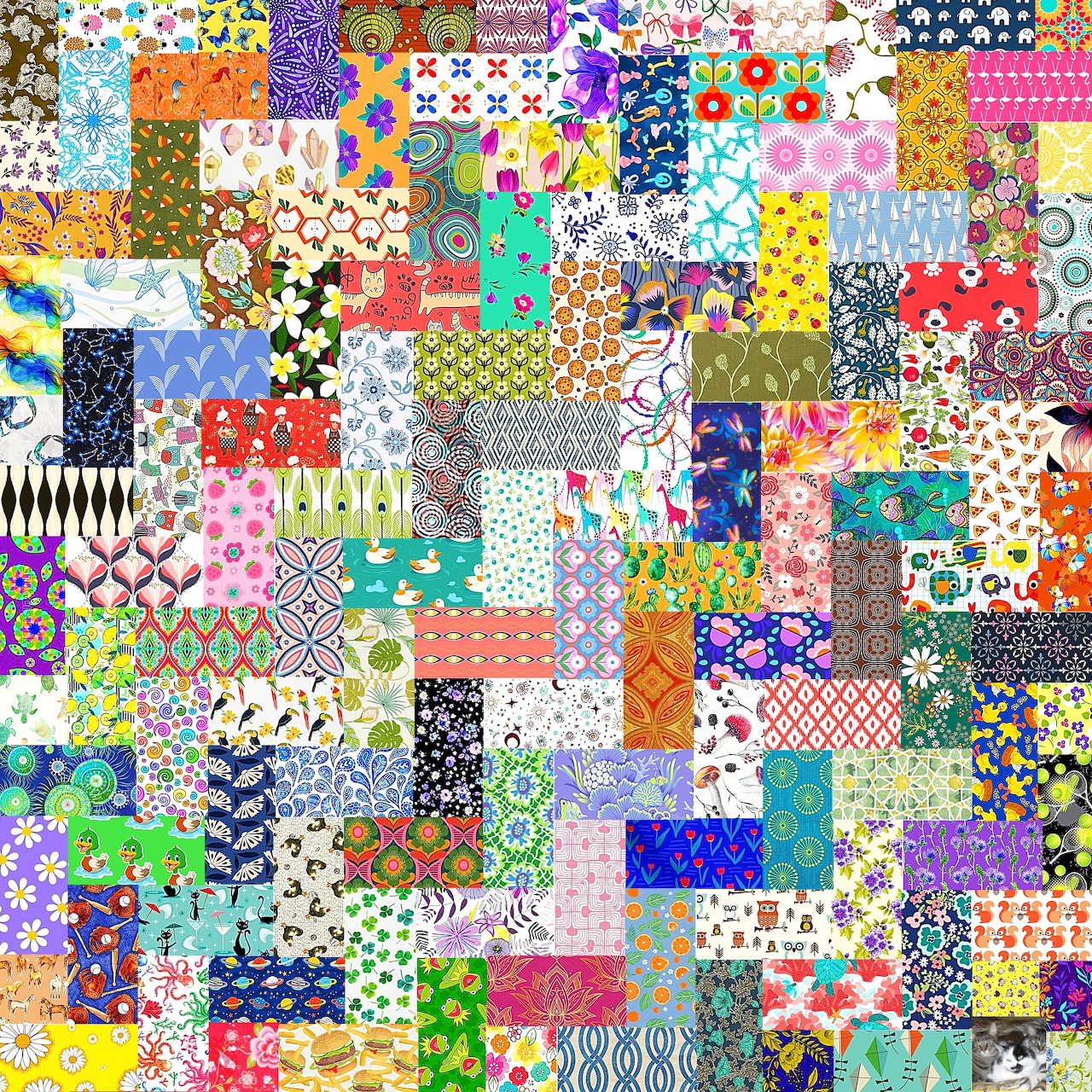 Colorful patchwork quilt with hundreds of different patterned fabric squares in various colors and designs