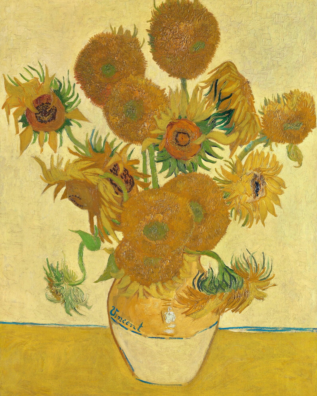 Van Gogh painting of yellow sunflowers arranged in a vase on a table