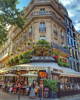 Corner view of Café de Flore in Paris with outdoor seating and classic French architecture