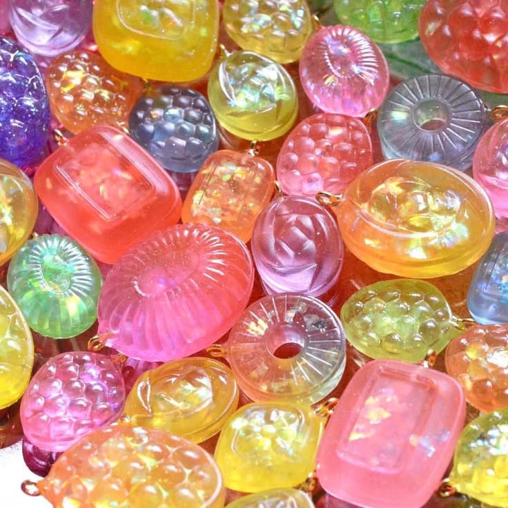Close-up of assorted translucent colorful beads scattered together