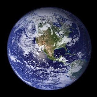 Satellite photo of Earth from space showing North America, oceans, and cloud formations