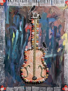 Mixed media art piece showing a guitar shape made from colorful bottle caps on a dark abstract painted background