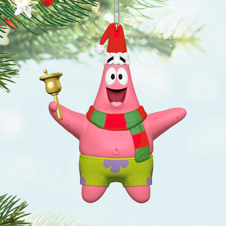 Patrick Star Christmas ornament holding a bell and hanging from a tree branch