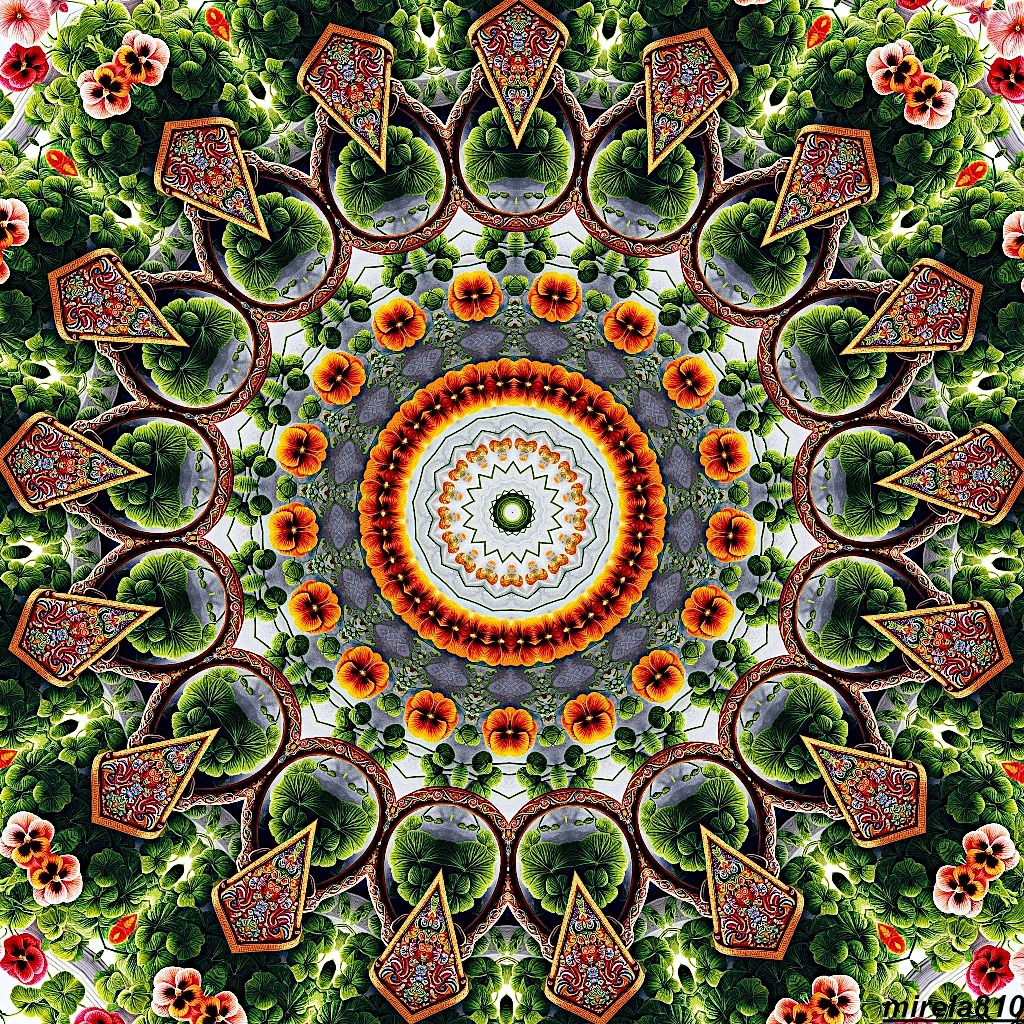 Symmetrical mandala with paisley and floral patterns in orange, green, and gold