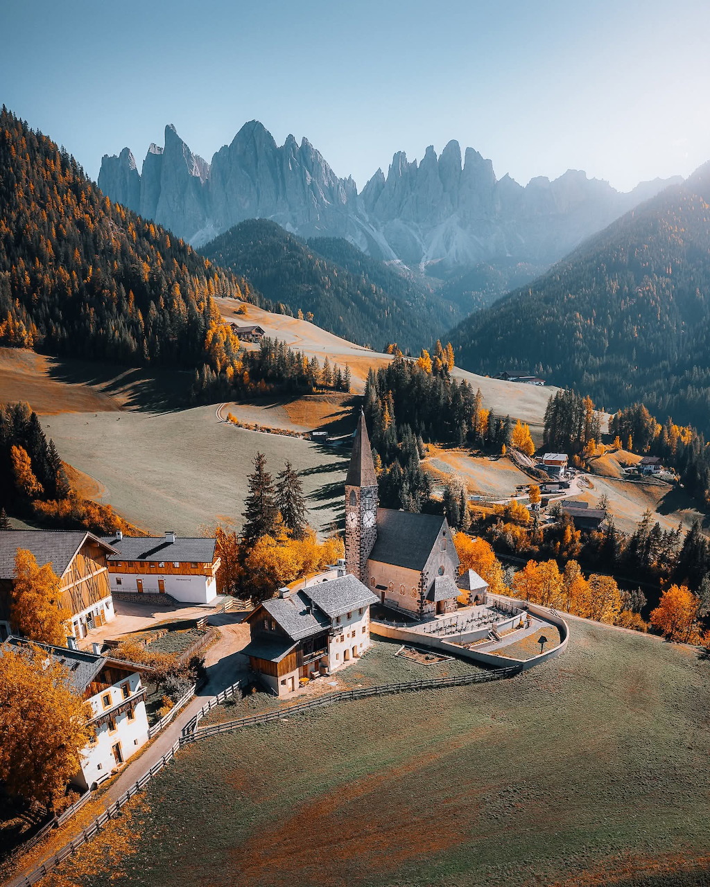 Dolomites mountain range with sharp peaks and green alpine valley