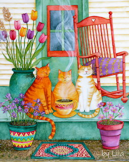 Three cats relaxing on a decorated porch with potted flowers and a red rocking chair
