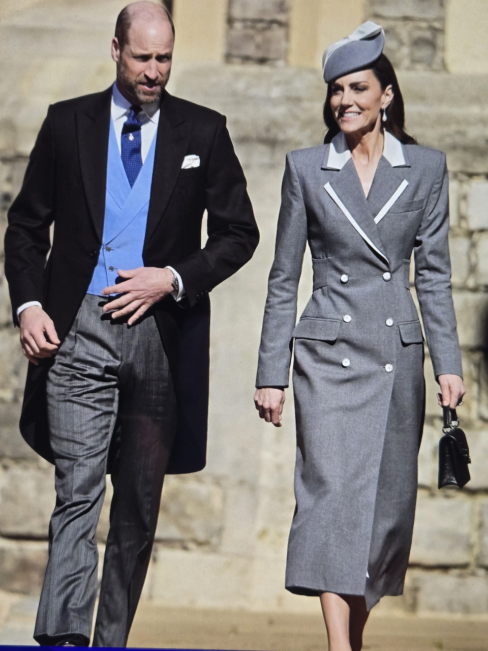 Couple in formal attire walking together outdoors
