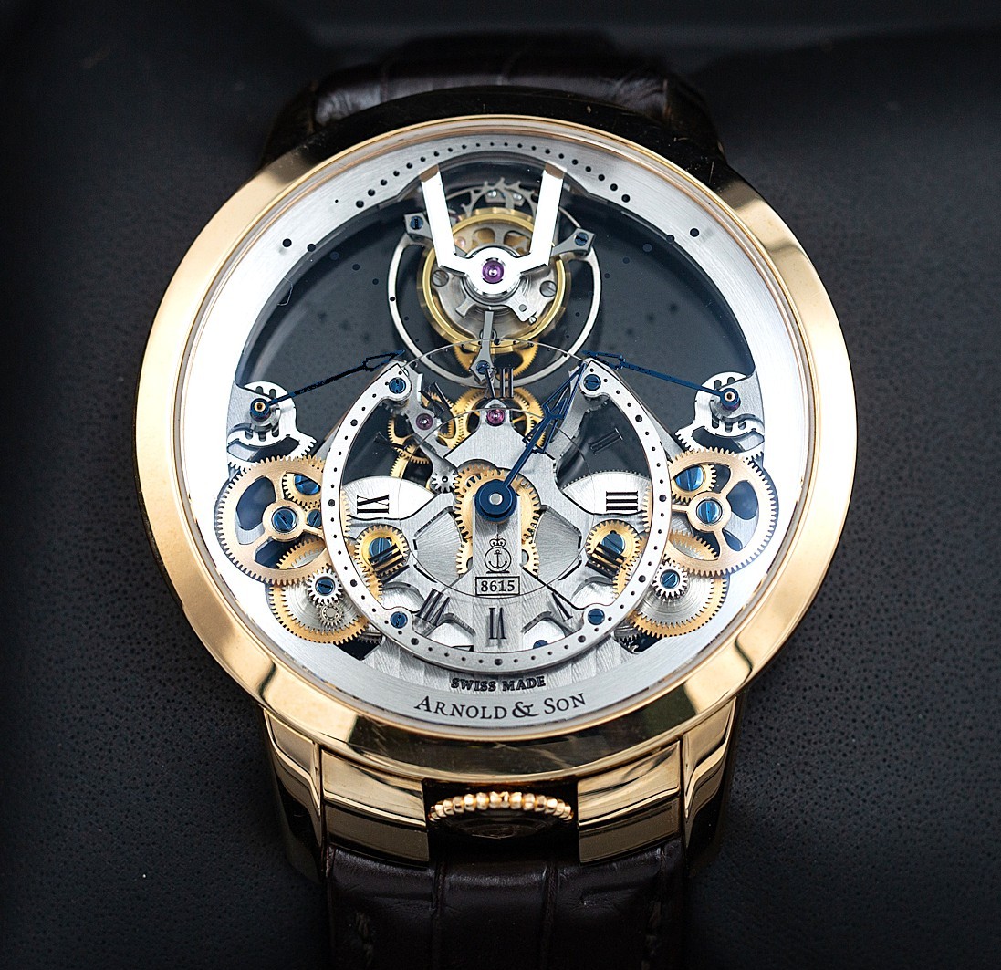 Close-up of an Arnold & Son Time Pyramid Tourbillon watch with exposed mechanical movement