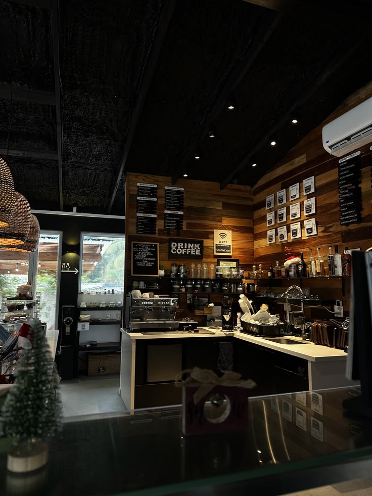 Dark moody coffee shop interior with wooden walls, menu boards, and espresso bar counter