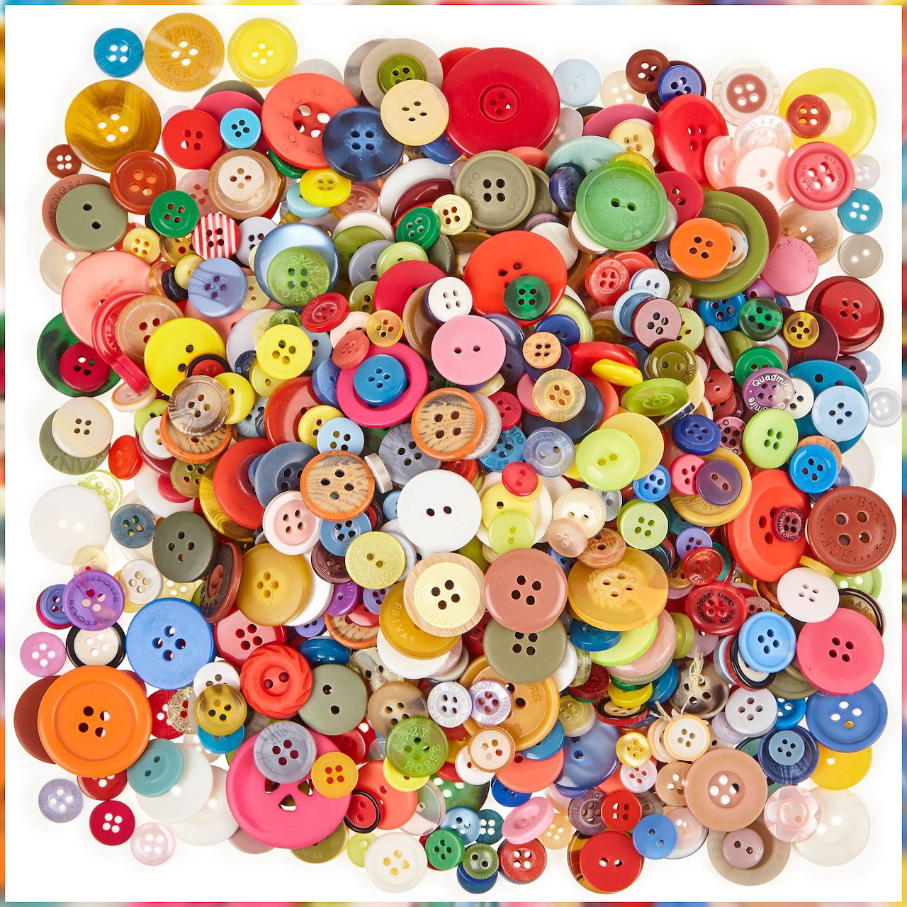 Pile of multicolored sewing buttons in assorted sizes and shapes on white background