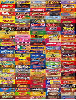 Dense collage of colorful candy bar wrappers arranged in horizontal rows