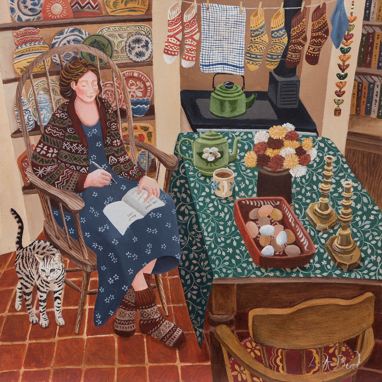 Woman sitting in wicker chair in colorful kitchen with patterned walls and green tablecloth