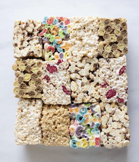 Assorted cereal marshmallow treat squares arranged in a grid showing different cereal varieties