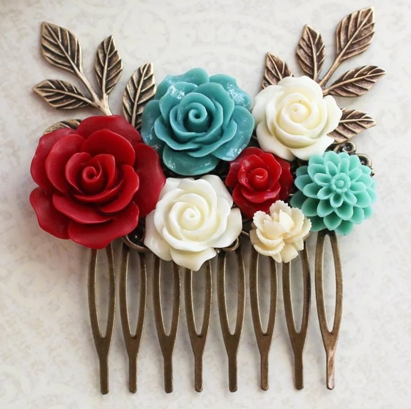 Decorative hair comb with colorful flower ornaments and metal leaf details