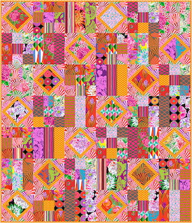 Colorful patchwork quilt with geometric blocks, floral prints, and pink orange yellow patterns
