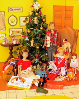 Vintage Barbie dolls Skipper, Ricky, and Scooter around a decorated Christmas tree with gifts and toys