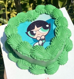 Green frosted cake with Buttercup from Powerpuff Girls character printed on top