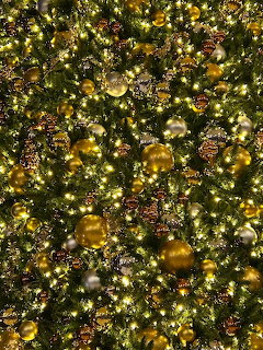 Christmas tree with gold ornaments and colorful decorations