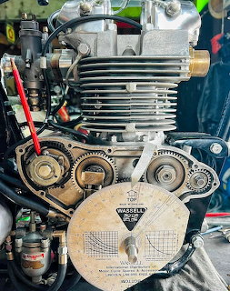 Vintage Triumph Tiger 500 motorcycle engine with finned cylinder head and timing chain visible