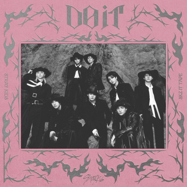 Pink album cover featuring a black-and-white group portrait framed by thorn-like designs
