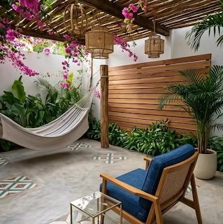 White hammock in a tropical patio with plants, wooden screen, and blue chair