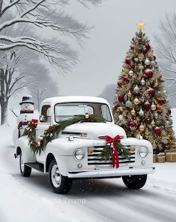 White vintage truck with Christmas wreath parked next to decorated tree in snow