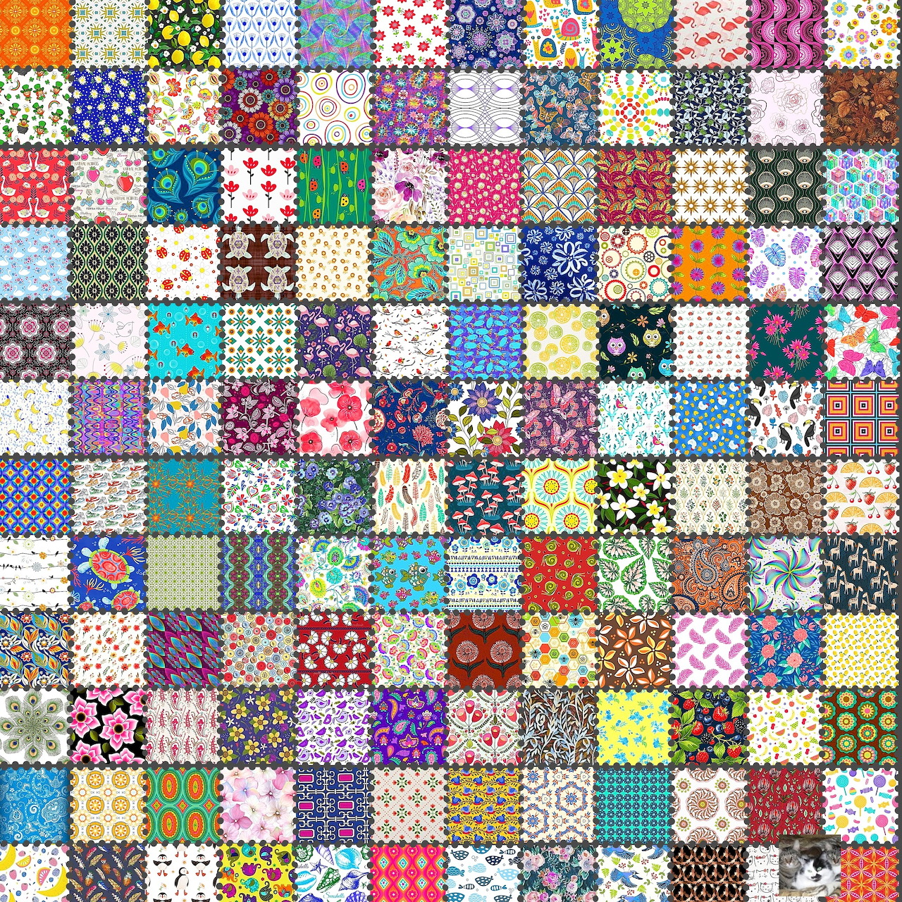 Colorful patchwork quilt with small squares in floral, polka dot, and geometric patterns