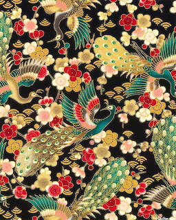 Decorative Japanese fabric with gold peacocks, fans, and floral patterns on black