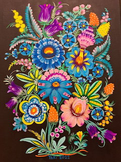 Colorful folk-art flowers painted on a dark background