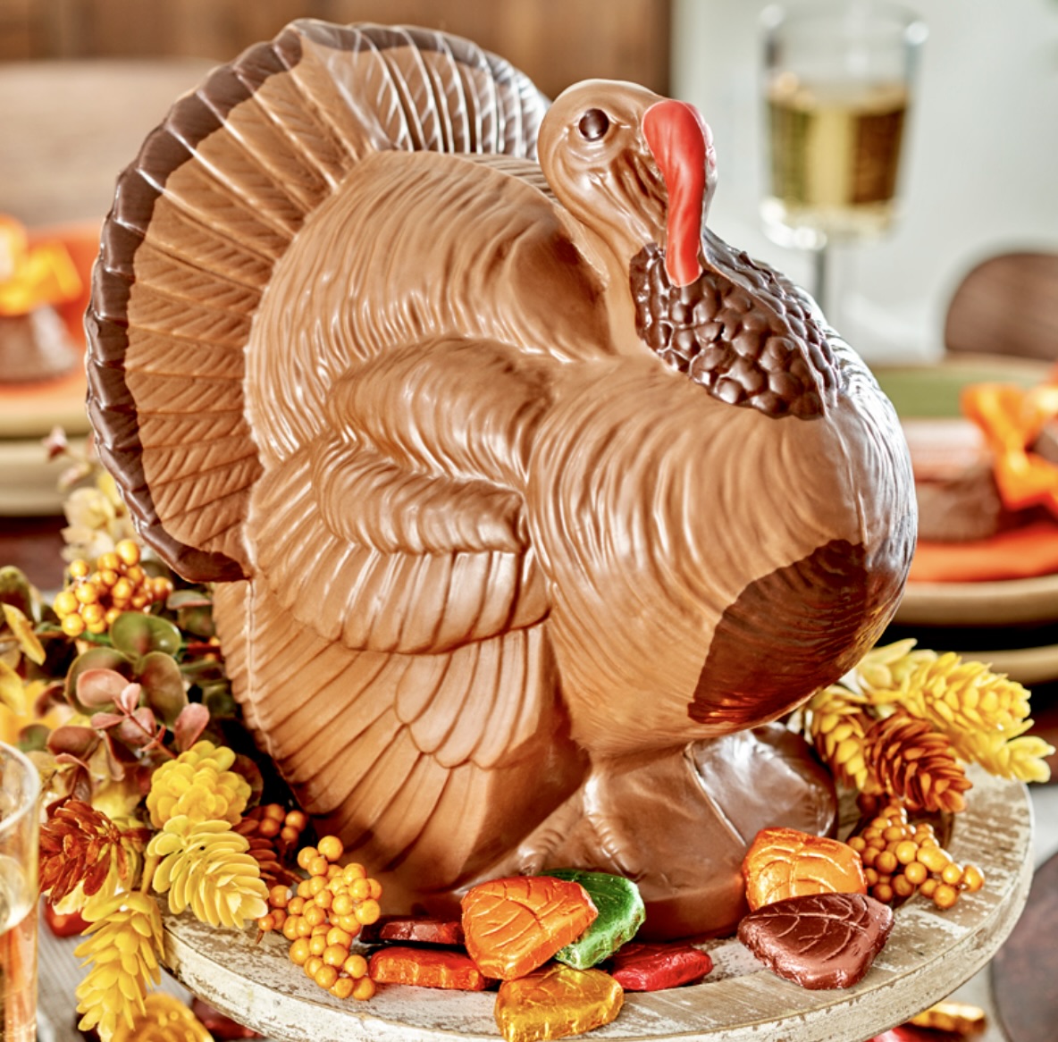 Chocolate turkey centerpiece on a decorated table with autumn candies and fall decor